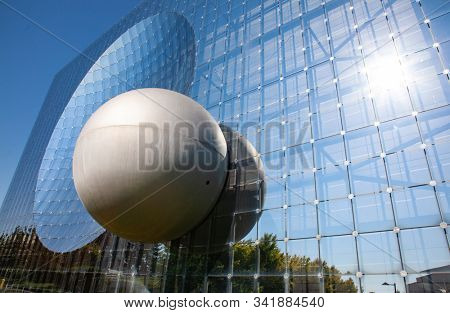 Poitiers, France - September 21 2010 : Glass building in Futuroscope, a French amusement park that lets you experience sounds, images, and sensations