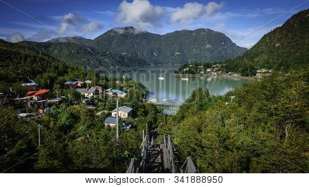 Beautiful Panoramic View Of The City Of Caleta Tortel In Patagonia Chile. There Are Several Houses B