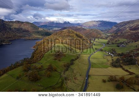 Beautiful Aerial Drone Landscape Image Of Glorious Autumn Fall Sun Over Thirlmere In Lake District
