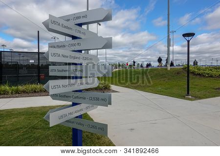 Orlando,fl/usa-11/16/19:  A Post With Signs And Distance To The United States Tennis Association Ust