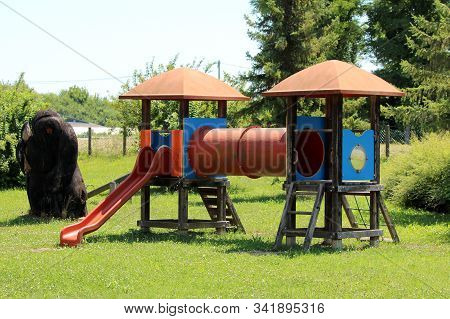 Two Outdoor Dilapidated Public Playground Equipments With Various Functions From Climbing To Slide C