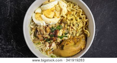 Soto Ayam Is Traditional Food From Indonesia, Served With Chicken, Noodles, Egg, Sambal And Fried On