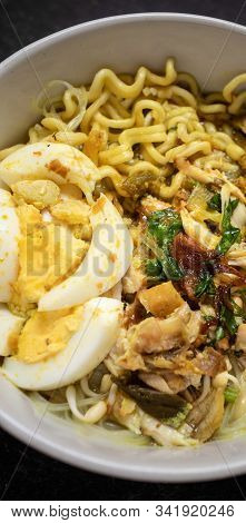 Soto Ayam Is Traditional Food From Indonesia, Served With Chicken, Noodles, Egg, Sambal And Fried On