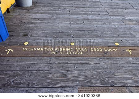 Santa Barbara, California - May 18, 2019: Designated Fishing Area Sign On Stearns Wharf At Sunrise.