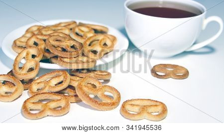 Pretzel And Tea. White Cup Of Coffee. Morning. Breakfast. Biscuits. Bakery Products. Dessert. Hot Dr