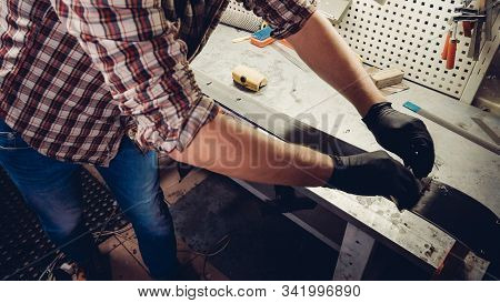 Ski Maintenence. Removing Excess Wax From Race Ski Base Plastic Scraper. Ski Service And Repair. Win