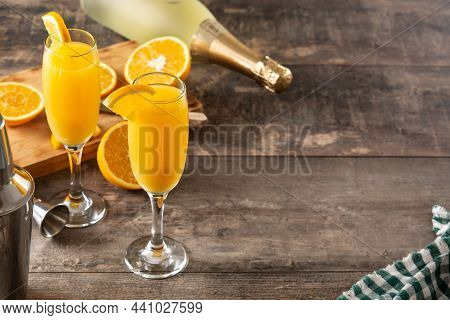 Orange Mimosa Cocktail On Wooden Table. Copy Space
