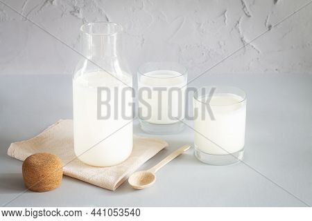 Vintage Jar With Cork Of Homemade Yogurt, Kefir, Fermented Milk Or Sour Cream Next To Drinking Glass