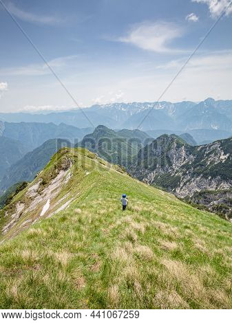 Young Child Boy Hiker Conquer The Peaks Of Amazing Mountain Trail Monte Montusel In Friuli-venezia G