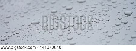 Closeup Of Drops On Dark Glass Car Background. Rainy Day Weather Forecast Concept