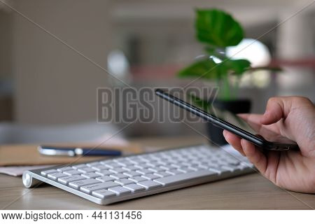 Close-up Of A Man\'s Hands Captured With A Smartphone, The Man Is On His Phone, Typing Social Media 