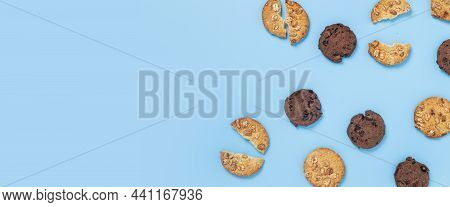 Chocolate Cookies With Chocolate, Cookies With Nuts On A Blue Background. Top View, Flat Lay. Banner