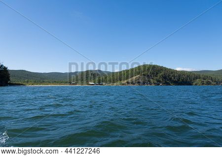 Chivyrkuisky Bay, Protected Area. View From The Water To Fishing Village On Svyatoy Nos Peninsula.