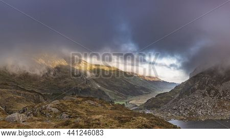 Epic Autumn Landscape Image Of View Along Nant Fracon Valley In Snowdonia National Park With Moody S