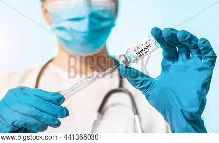 Woman Doctor Holding A Syringe And Ampoule With A Vaccine In Her Hand New Variant Of The Covid-19 Om