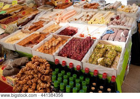 Assorted Turkish Delight Or Lokum Sweets On Turkish Bazaar Market. Trading Lokum Rolls On Street Mar