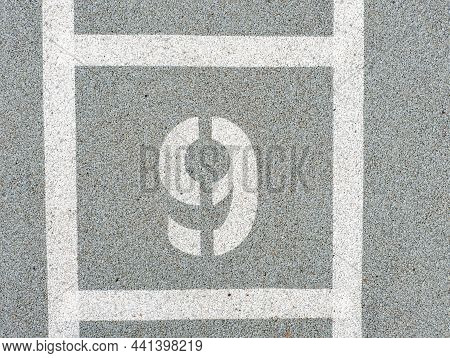 Number Nine Painted On Soft Rubber Surface. The Nineth Place. Jumping Hopscotch Game With Numbers. S