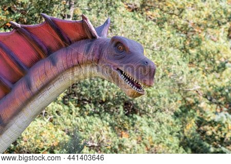 Ukraine, Khmelnitsky, October 2021. Dinosaur, Amargasauruss Close Up With Open Mouth And With A Long