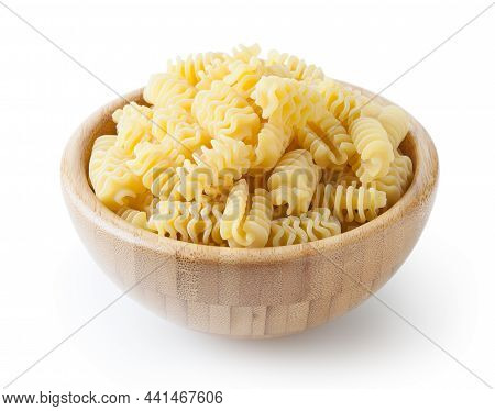 Uncooked Radiatori Pasta In Wooden Bowl Isolated On White Background With Clipping Path