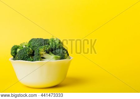 Broccoli Of Fresh Green Broccoli In Bowl Over Coloredbackground. , Close Up. Fresh Vegetable.