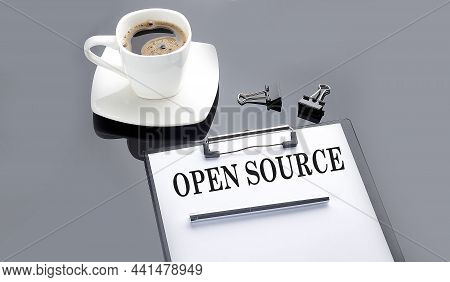 Open Source Text On The Paper Sheet With Coffee On The Black Background