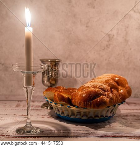 Shabbat Shalom - Challah Bread, Shabbat Wine And Candles On Wooden Table.