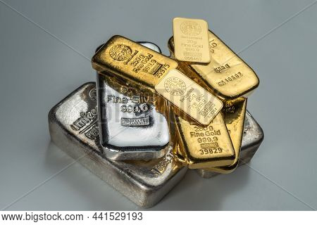 Kyiv, Ukraine - December 05, 2018: A Pile Of Gold And Silver Bars Of Various Weights From Different 