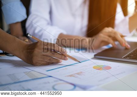 Business Team Hands At Working With Financial Plan, Meeting, Discussion, Brainstrom With Laptop On O