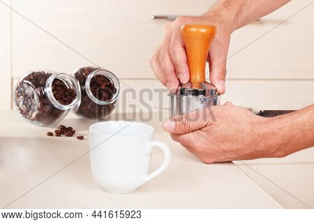 Coffeemaker Tamp Ground Coffee With Tamper On The Table.