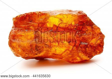 Natural Amber. A Piece Of Yellow Opaque Natural Amber On White Background.