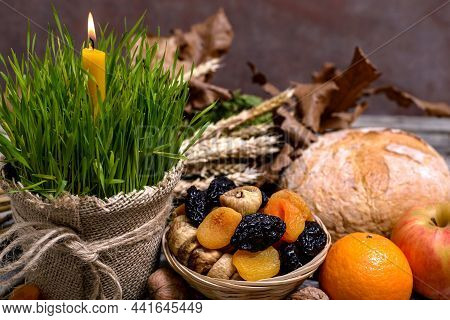 Traditional Food For Orthodox Christmas Eve. Yule Log Or Badnjak, Apple, Mandarins, Cereals, Dried F