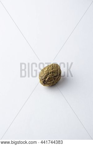 Dried Nutmeg Isolated On A White Background