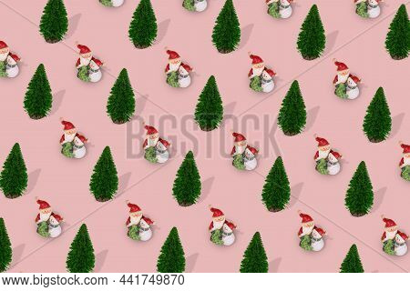 Cute Pattern With Christmas Tree And Santa Claus And Snowman In An Embrace On A Bright Pink Backgrou