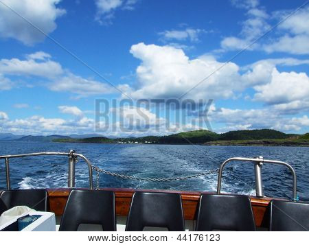 A trip by a bout on a sunny school Oban Scotland