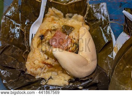Nacatamal Served In Banana Leaf, Close Up Of Nicaraguan Nacatamal, Typical Nicaraguan Food El Nacata