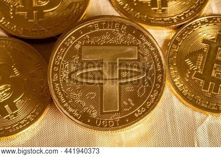 Concept Of Tether Coin Against Golden Bitcoin Coins. Tether Is Backed By Us Dollar And Used For Trad