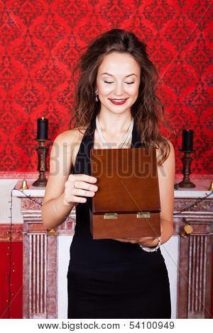 Beautiful Girl In Vintage Interior Opening Gift Box