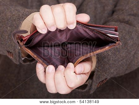 Businessman Showing Empty Wallet. Finance And Economy.