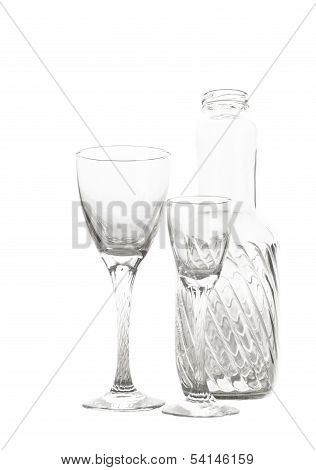 Wine glasses and bottle isolated on white