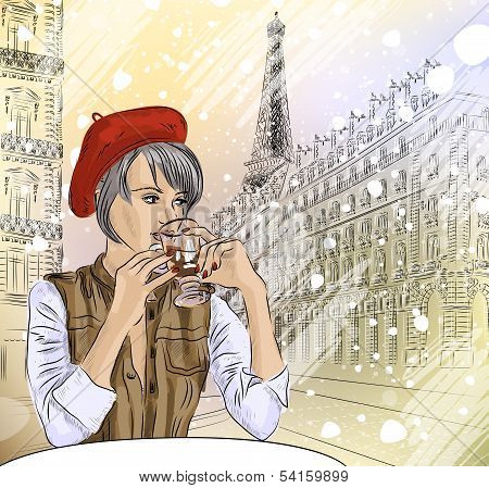 Beautiful girl in the street cafe in Paris drinking coffee