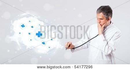 Proffesional doctor listening to abstract cloud with medical signs