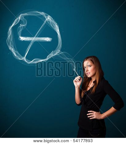 Pretty young lady smoking unheathy cigarette with no smoking sign