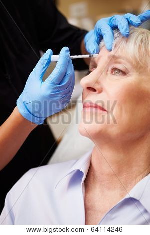 Woman Having Botox Treatment At Beauty Clinic
