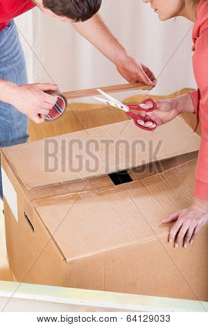 Couple Taping The Box