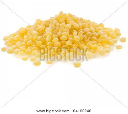 Israeli couscous pile (Ptitim) close up isolated on white background 