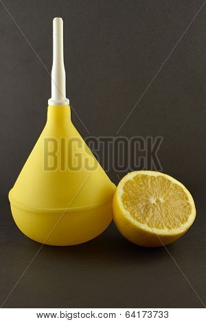 Medical Enema With Lemon On Dark