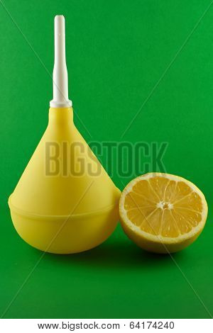 Medical Enema With Lemon On Green