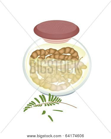 Preserved Tamarinds In A Jar On White Background