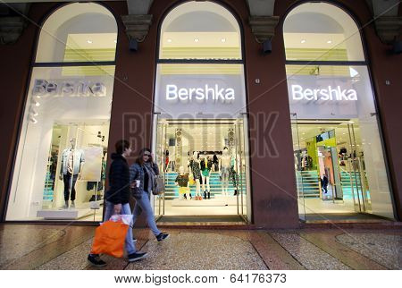 BOLOGNA, ITALY - APRIL 19, 2014: Shoppers walk past a Bershka clothing store in Bologna, Italy, on Saturday, April 19, 2014. Bershka is a retailer and part of the Spanish Inditex group. 