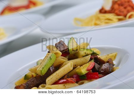 Pasta with shrimps, herbs and mashrooms isolated on white background in studio